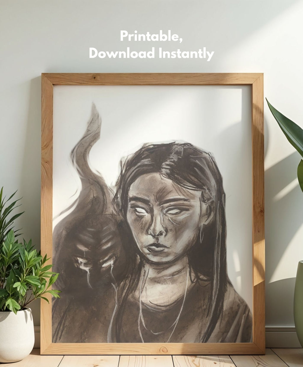 Framed black and white art print of a woman with a cat on a wooden floor.