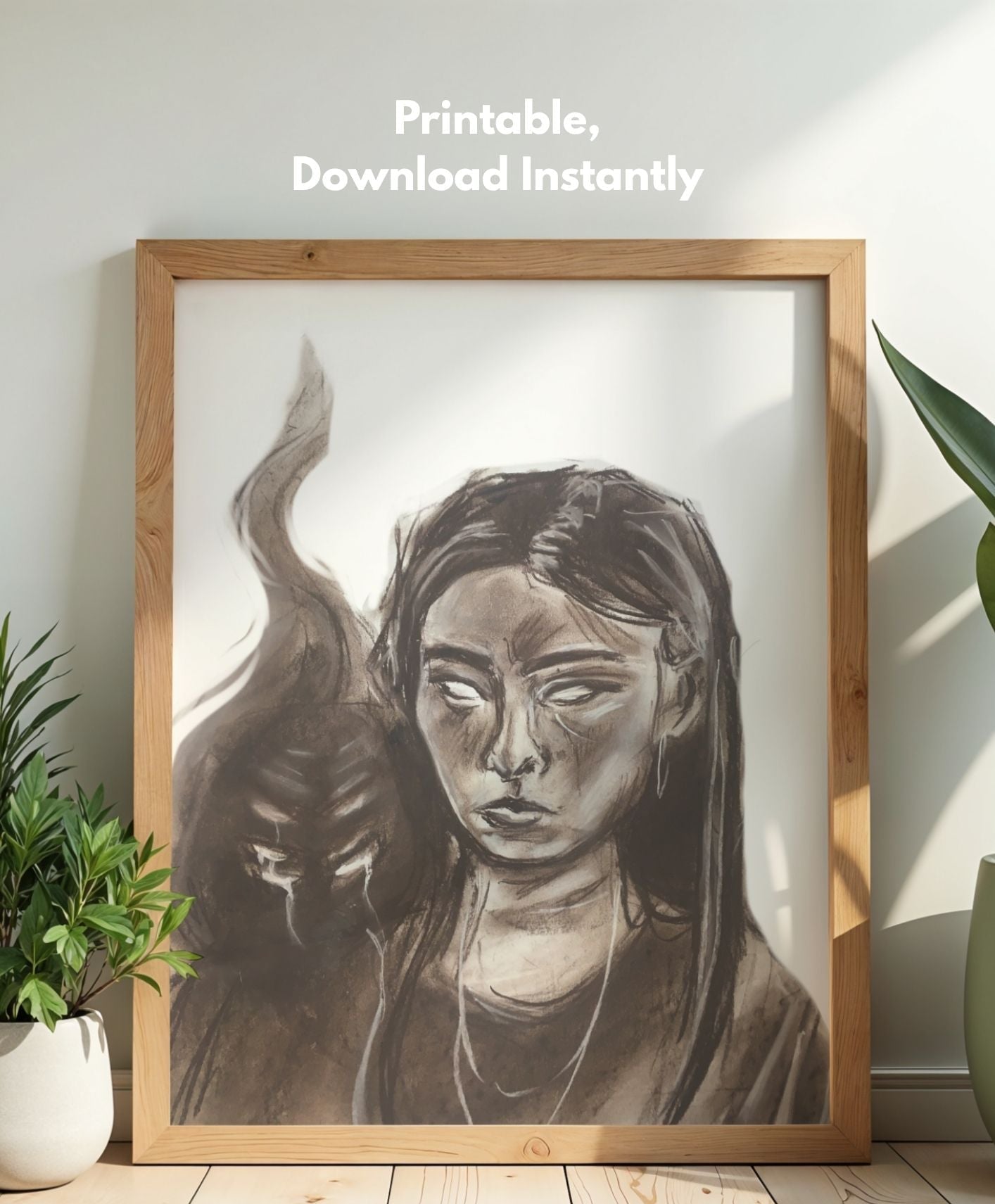 Framed black and white art print of a woman with a cat on a wooden floor.